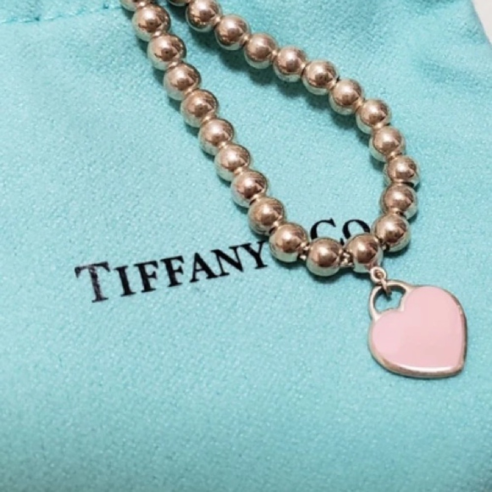 Tiffany & Co. Silver  Bead Bracelet with pink Heart Charm.